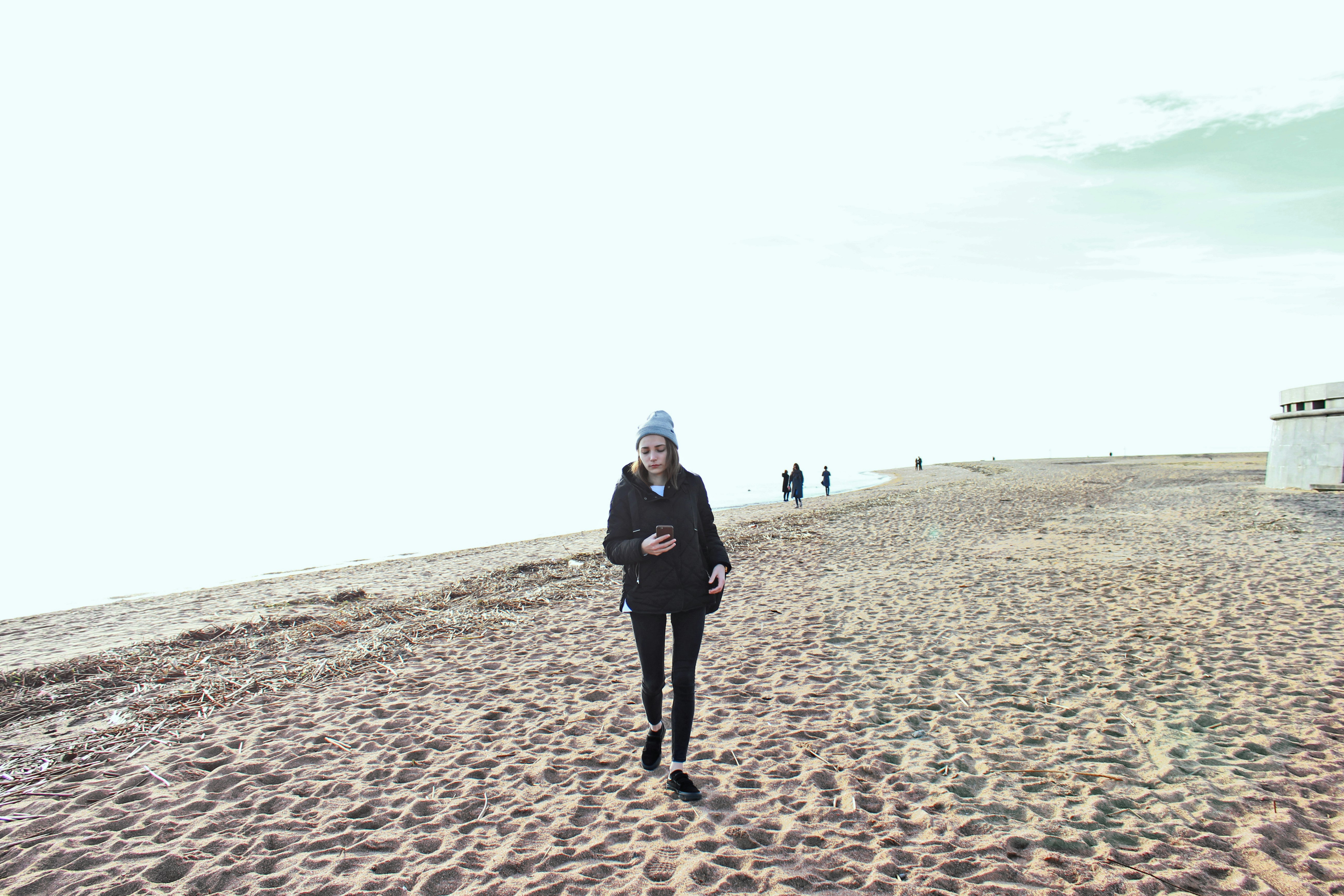 woman walking on shore